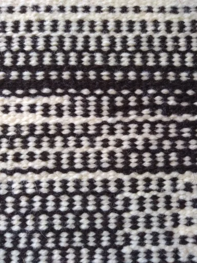 zoom sur la technique de tapisserie hachure qui permet le passage d'un ton à l'autre